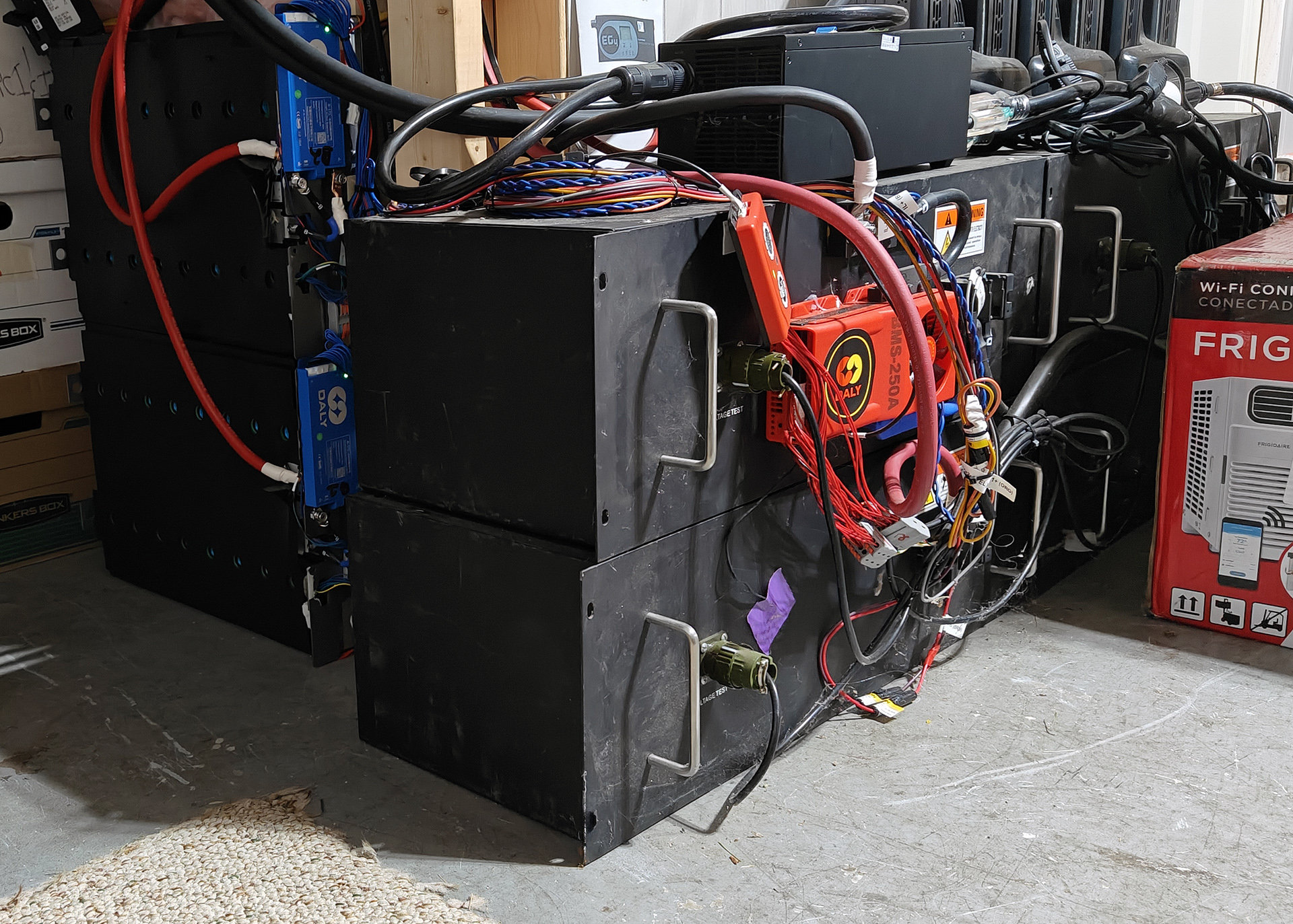 As of 2026, the Microgrid LFP stack. 30kWh (Note the size of the 10kWh 2026 batteries on the left (two 5kWh units), and the 20kWh 2014 batteries on the right (four 5kWh units)
