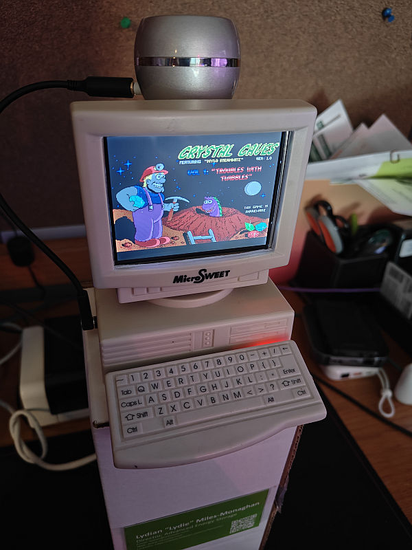 it's a tiny x86 PC that runs DOSBOX. In a pencil sharpener case. 3.5" screen !